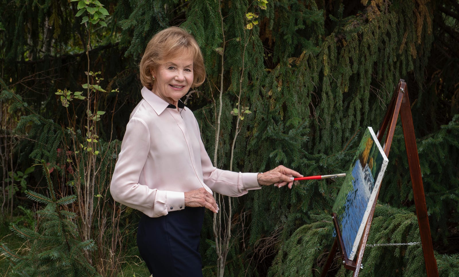 Artist Mary Vanek Smith at work on her latest painting